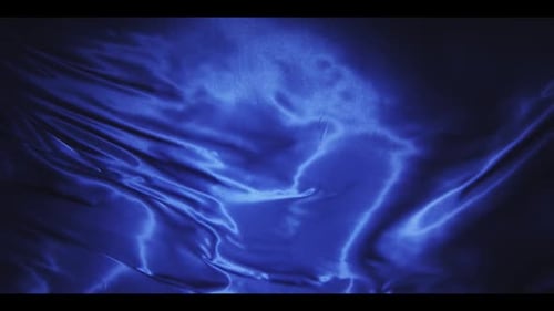 Abstract Rippling Blue Fabric Background