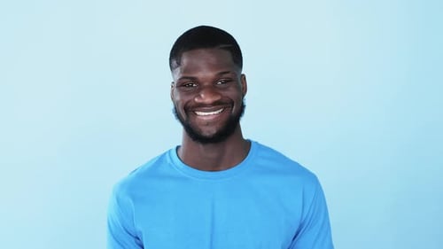 Man Smiling and Looking at the Camera