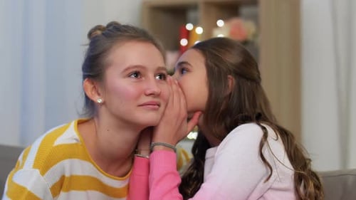 Happy Teenage Girls Gossiping at Home