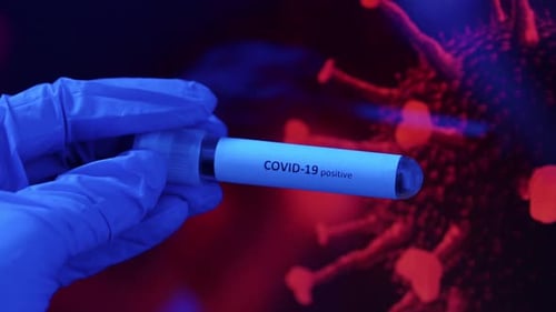 COVID-19 Positive Test Tube Held in Gloved Hand