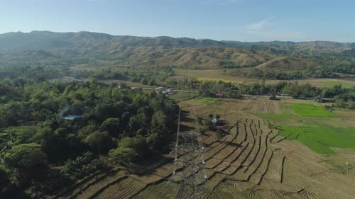 Aerial View of Powerlines Across Rural Landscape