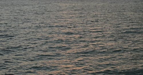 Sea wave under sunset