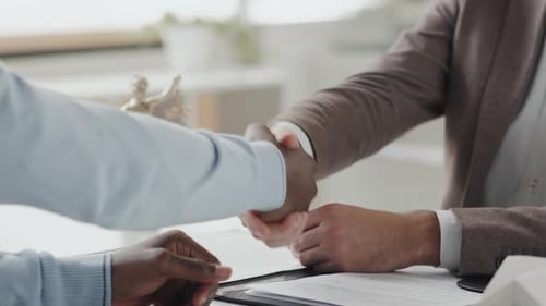 Lawyer Shaking Hands with Client