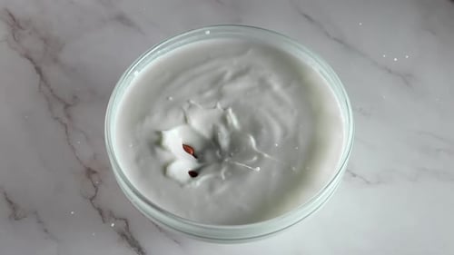 Peanuts Fall Into Thick Yogurt