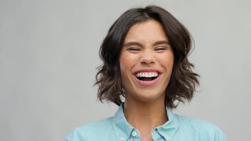 Woman Laughing Happily in Close Up Portrait