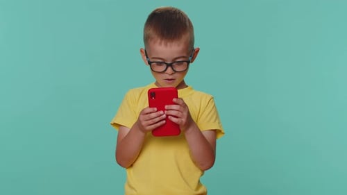 Child Uses Smartphone in Mid Shot