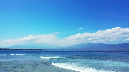 Natural flying island view of a sunshine white sandy paradise beach and blue water background
