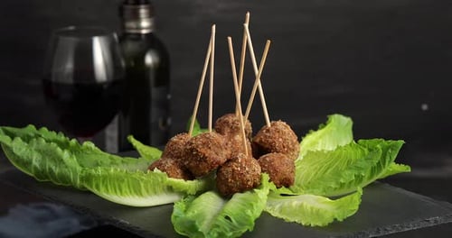 Meatballs with Wine in Restaurant or Home
