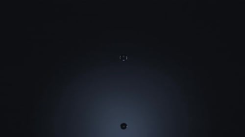 Liquid Drop Creates Ripples on a Water Surface