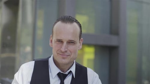 Adult Man Smiling Wearing Vest and Tie