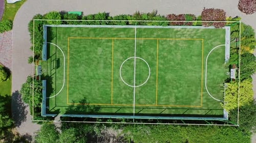 Small football pitch. Modern sportsground of the recreation complex among nature.
