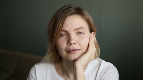 Smiling Woman Looking at Camera Indoors