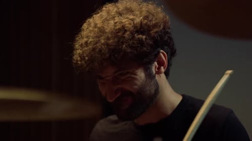 Drummer Playing on Drum Kit in Studio, Emotional Male Musician Rehearsing Indoor