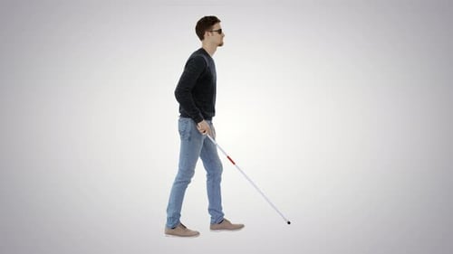Blinder junger Mann mit einem Stock auf Farbverlaufshintergrund.