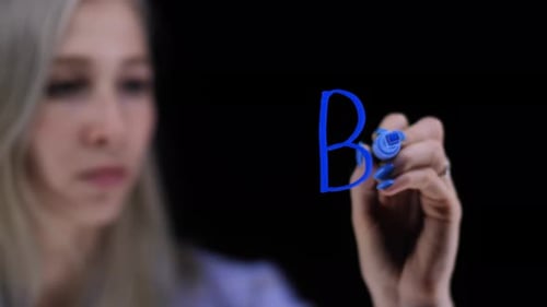 Woman Writing Brand on Clear Screen