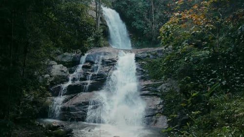Refreshing Waterfall Cascades Through Verdant Nature