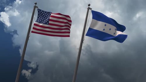 United States and Honduras Flags Waving Together Against Cloudy Sky