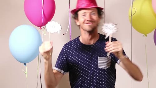 Handsome man dancing in photo booth