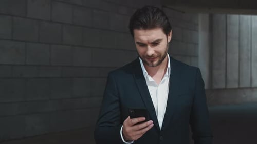 Businessman Texting Message on Cellphone Outdoors, Man Using Smartphone in City