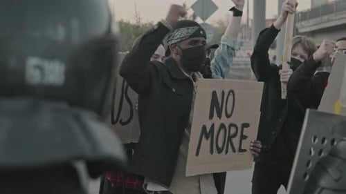 Protesters Hold Signs During a Demonstration