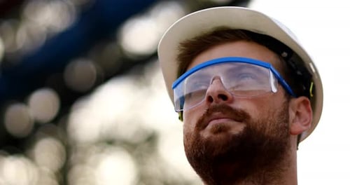 Construction Worker Wearing Hard Hat and Safety Glasses