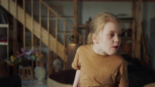 The Child Makes Funny Faces and Wrinkles While Singing a Song