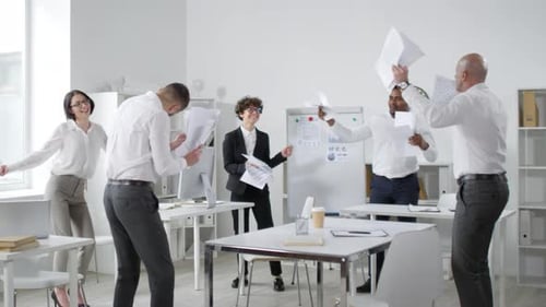 Team Dancing and Tossing Up Papers