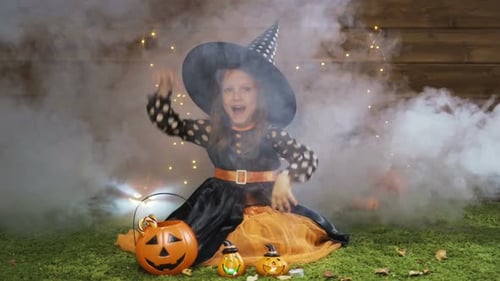 Little Girl Dressed as a Witch for Halloween