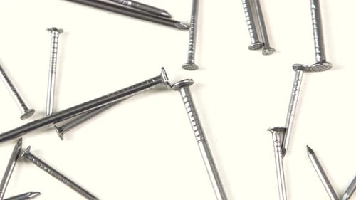 Metal Nails on White, Rotation, Close Up