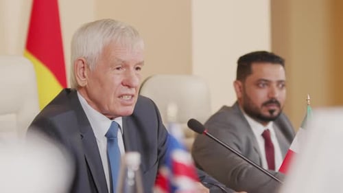 Men Discuss Politics and Business at Conference