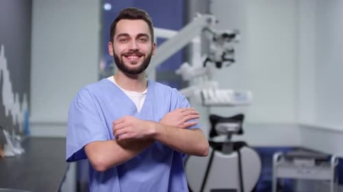 Happy Dentist in Scrubs Posing