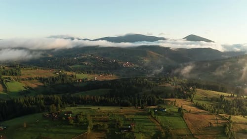 Aerial View of Foggy Sunrise in the Mountains