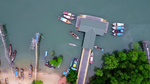 Aerial view from drone of Ao Thalane Pier with many fishing boats moored.