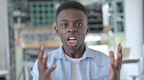 Upset Young Adult Screaming and Pointing