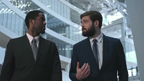 Businessmen Talking in Modern Office Building