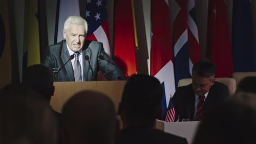 Man Delivering Speech at International Conference