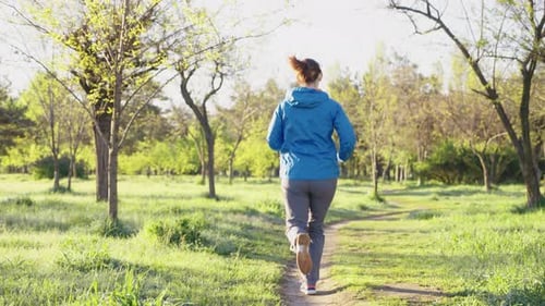 Slow Motion Woman Jogging in Nature