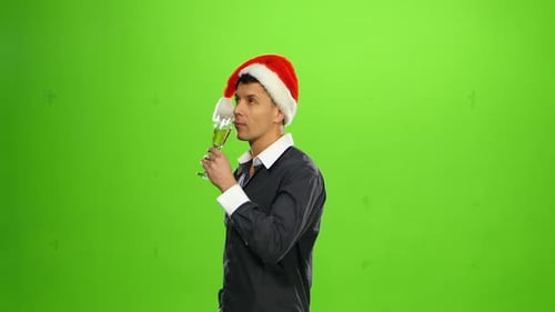 Happy Smiling New Years Eve Celebrating Man with Hat on Party. Green Screen