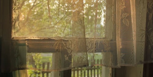 Sunlight Through Lace Curtains at the Window