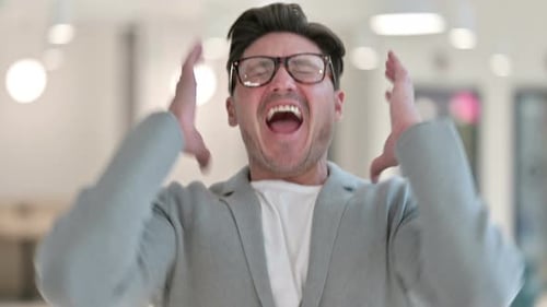 Man Yelling Expressing Frustration in Office Setting