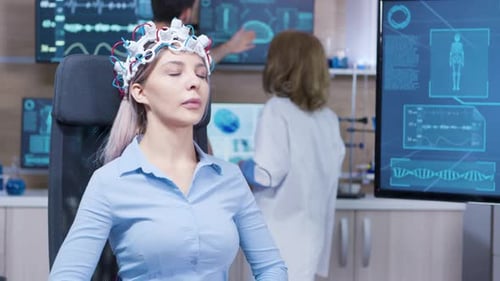 Female Patient Sitting on a Chair and Wearing Brain Activity Sensors
