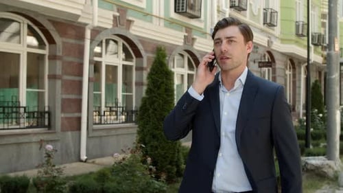 Business Man Talking Phone at Street. Businessman Discussing Business Outdoor