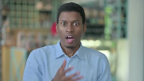 Surprised Young Adult Man Covers Mouth