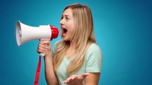 Woman Shouting Into Megaphone on Blue Background
