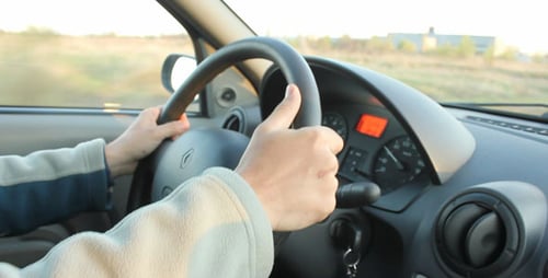 Hands on Steering Wheel Driving on Rural Road