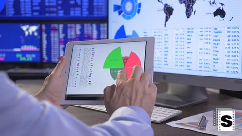 Financial Data Analysis on Tablet in Office