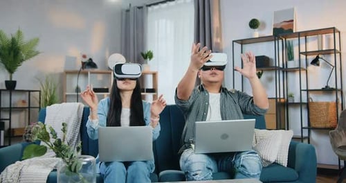 Couple Exploring Virtual Reality in Living Room