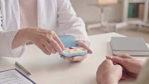 Doctor Explains Medication to Patient in Clinic