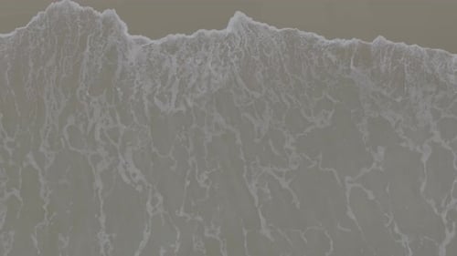 Birds Eye View of Waves Meeting Shore