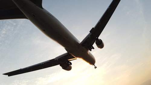 Passenger Plane Flying Overhead During the Day